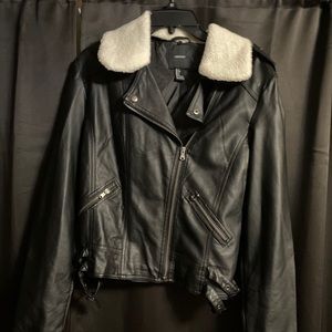 Black faux leather jacket. Shell lined.